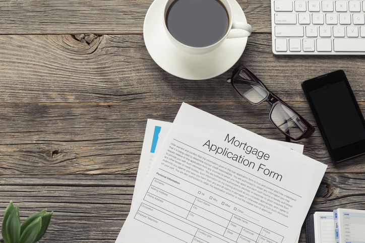 Mortgage application form on wooden table
