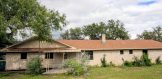 505 Queen Ann George West Brick Home Residential for Sale Back Exterior 1