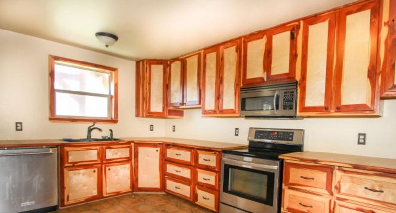 Kitchen room with wooden cabinet and oven